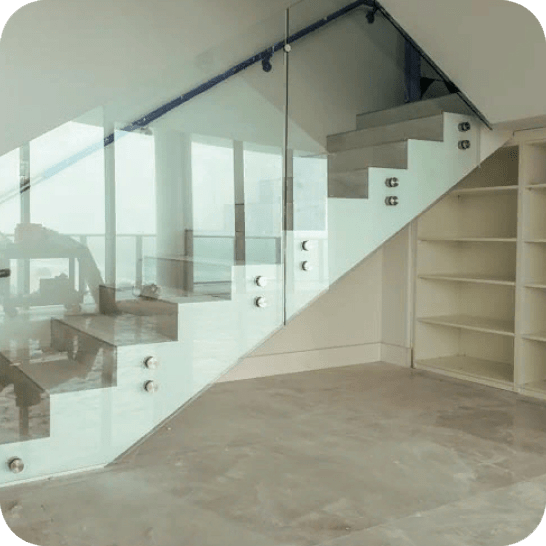staircase with transparent glass railing