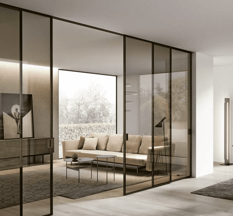 Modern living room with large glass walls and a minimalist design