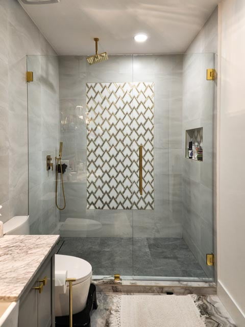 Shower screen with gold fittings