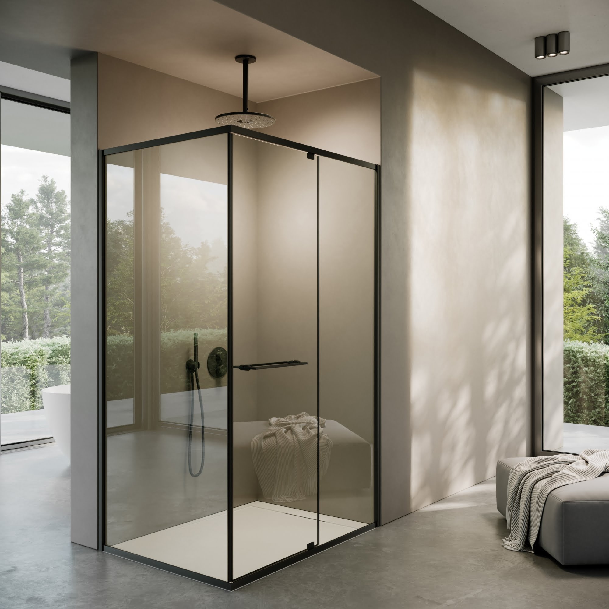 A modern bathroom with a sleek, glass-enclosed shower stall bathed in natural light